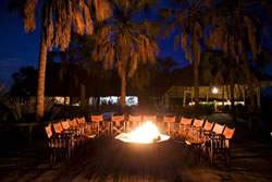 Maramboi main house at night, a campfire