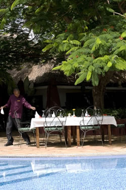 Dining poolside at Ngorongoro Farm House Dining poolside at Ngorongoro Farm House
